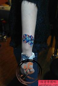 girl's wrist small and delicate color floral tattoo pattern