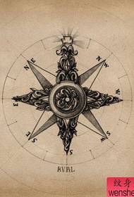 ett klassiskt kompass-tatueringsmanuskript