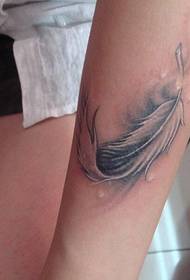 super beautiful arm feather tattoo