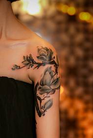 a very beautiful arm flower tattoo pattern