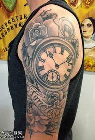 Arm schwarz grau Uhr Tattoo Muster