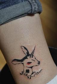 Deer head tattoo picture on bare feet is super cute