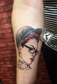 arm female portrait tattoo