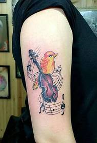 ein musikliebendes Vogel Arm Tattoo Tattoo
