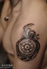 hand clock totem tattoo
